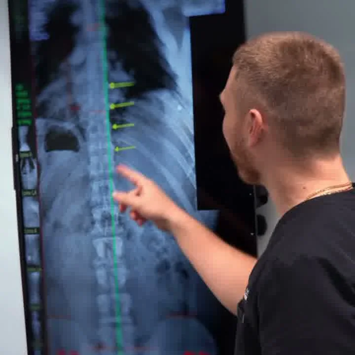 Limitless Life Chiropractic doctor reviewing a patient's digital spinal X-ray